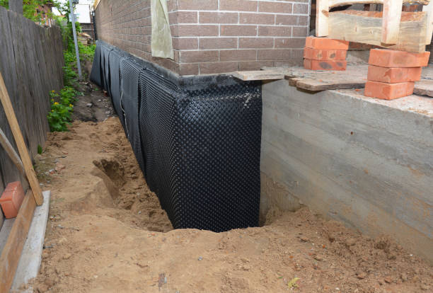 Happy homeowners after waterproofing job in Irwin